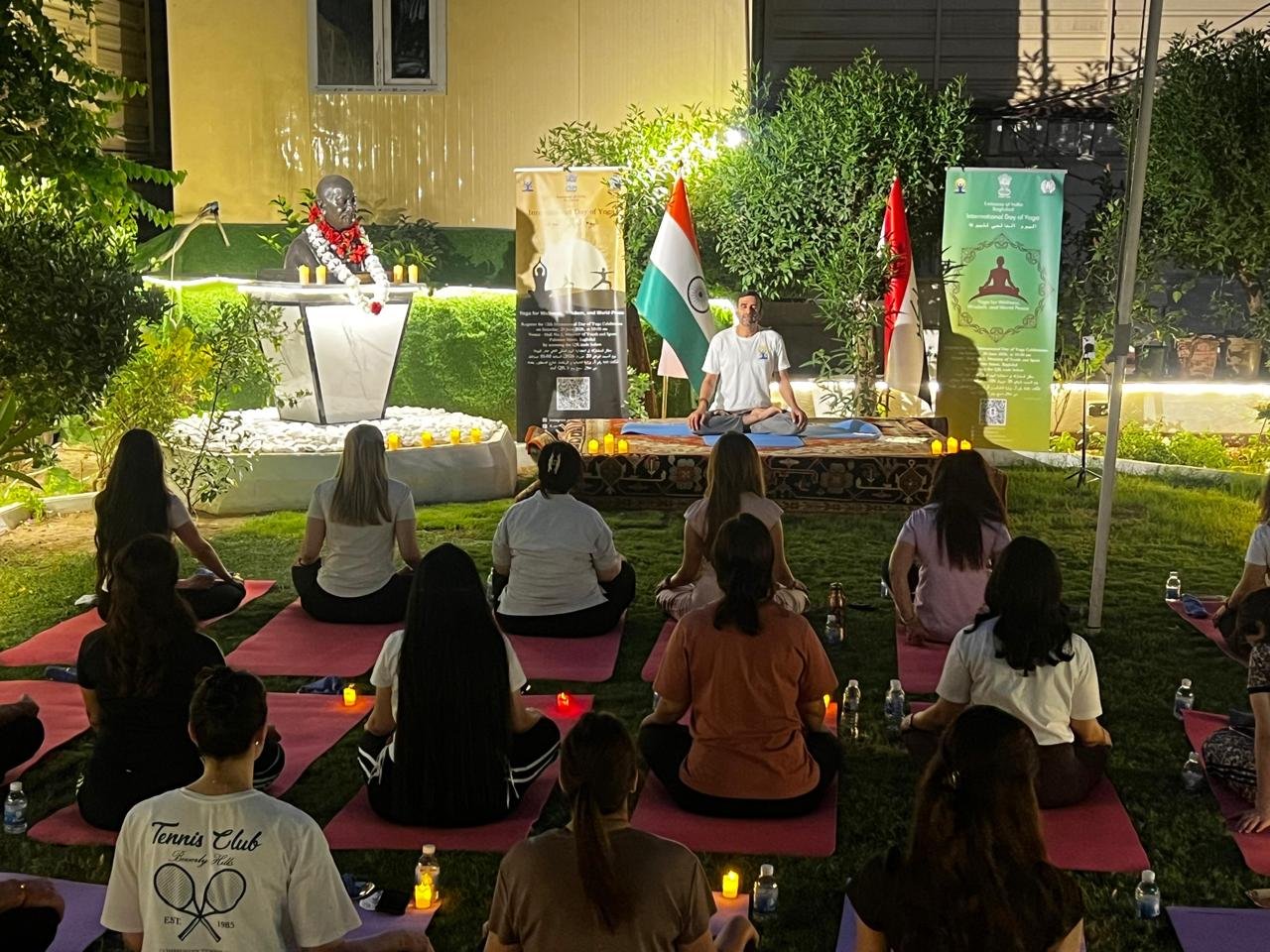 The Embassy organized a special candlelight yoga session for yoga experts on 22 June 2026 at the Chancery lawn beside Mahatma Gandhi bust. This marked the conclusion to the International Day of Yoga celebrations 2026, reaffirming the values of mindfulness, harmony and well-being. The session was led by former Embassy Teacher of Indian Culture (TIC) Dr. Dheeraj Prakash Joshi. Certificates of appreciation were handed over to embassy-trained expert yoga instructors for their contribution in continuing the yoga classes after departure of TIC from Baghdad. A closing speech was given by Ambassador Soumen Bagchi in which he thanked everyone for their zealous participation and invaluable contribution in making the IDY 2026 a huge success. This was followed by an Indian dinner for all the participants. Celebrations for IDY 2026 are over but yoga classes in the Indian Embassy are not. So Register Now.