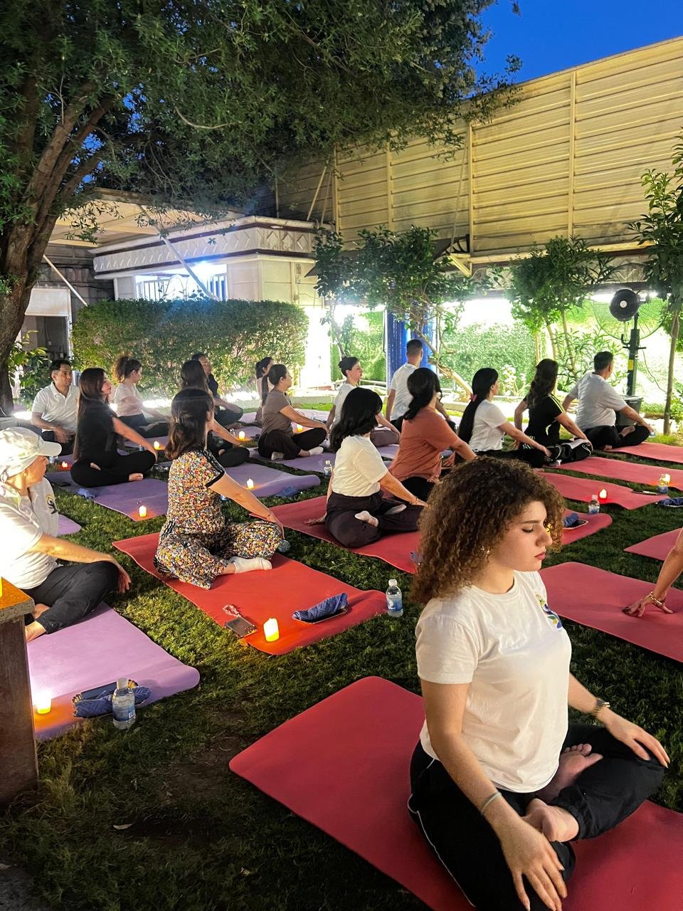 The Embassy organized a special candlelight yoga session for yoga experts on 22 June 2026 at the Chancery lawn beside Mahatma Gandhi bust. This marked the conclusion to the International Day of Yoga celebrations 2026, reaffirming the values of mindfulness, harmony and well-being. The session was led by former Embassy Teacher of Indian Culture (TIC) Dr. Dheeraj Prakash Joshi. Certificates of appreciation were handed over to embassy-trained expert yoga instructors for their contribution in continuing the yoga classes after departure of TIC from Baghdad. A closing speech was given by Ambassador Soumen Bagchi in which he thanked everyone for their zealous participation and invaluable contribution in making the IDY 2026 a huge success. This was followed by an Indian dinner for all the participants. Celebrations for IDY 2026 are over but yoga classes in the Indian Embassy are not. So Register Now.