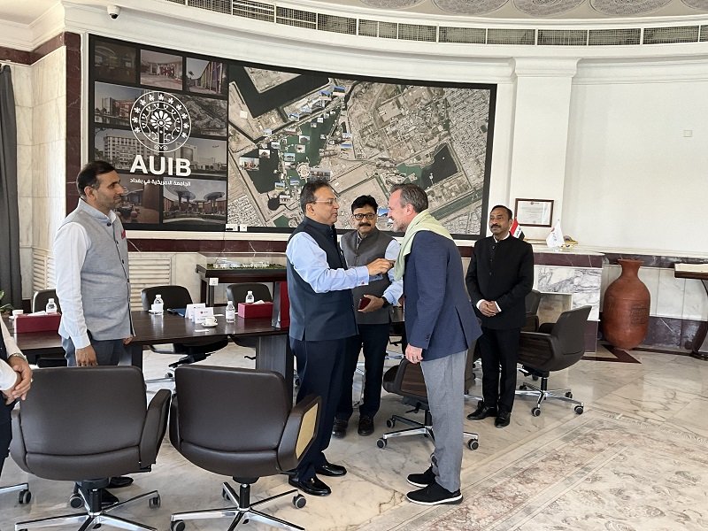 On the occasion of Mahatma Gandhi’s 156th Birth Anniversary, Ambassador Soumen Bagchi, accompanied by Embassy officials, visited the American University of Iraq – Baghdad (AUIB). AUIB President Dr. Bradley Cook welcomed the delegation and briefed them on the university’s initiatives and future plans.  Ambassador presented a traditional Indian woollen stole to the President. The visit concluded with the Ambassador and Embassy officials paying floral tribute at the bust of Mahatma Gandhi installed on the campus, followed by a visit to the ‘India Corner’ established at the AUIB library.